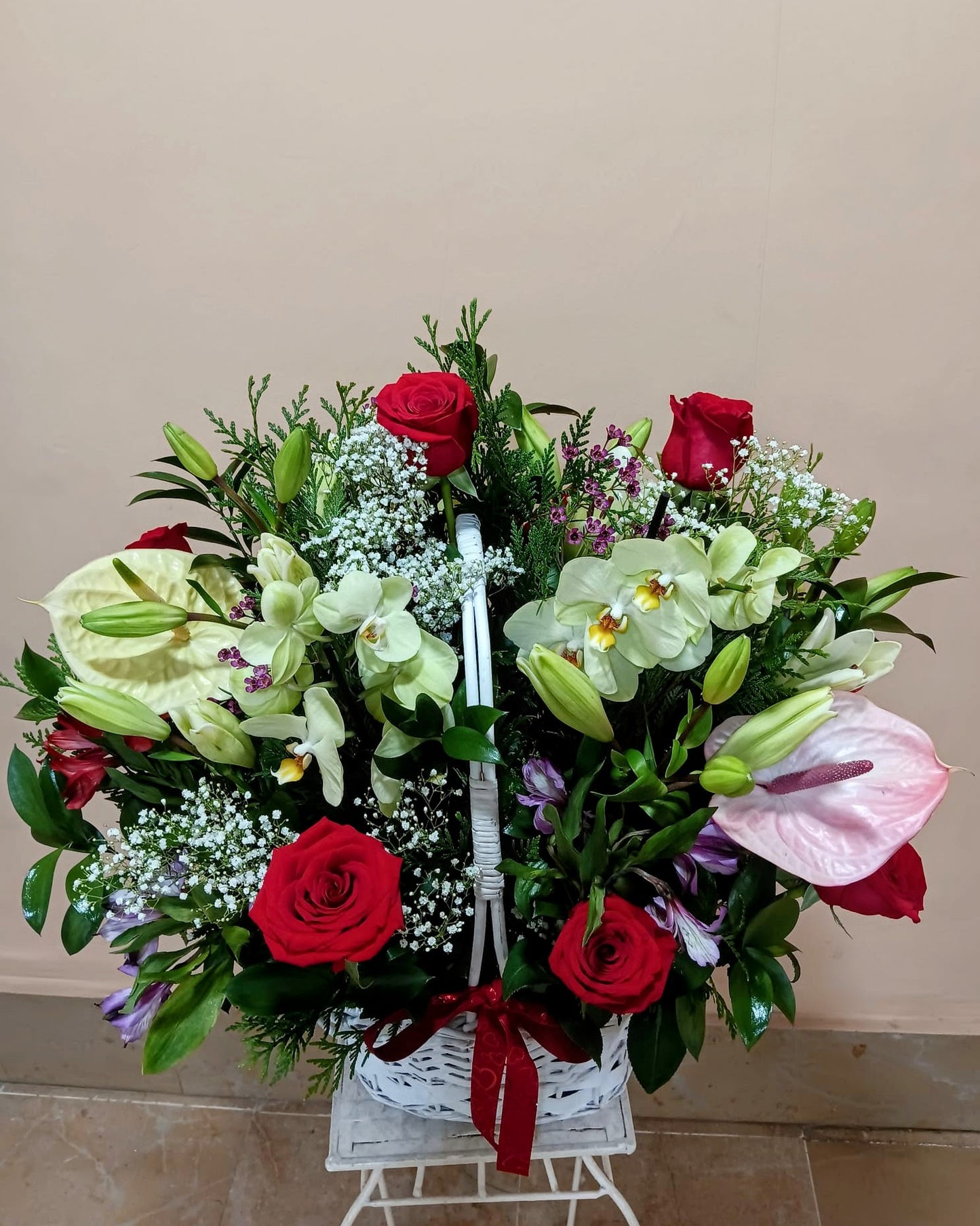 Basket of roses, anthurium and orchids